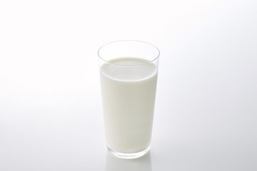 fresh milk in the glass on white background