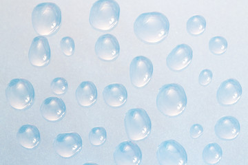 Water bubbles texture background / Liquid surface pattern on glass material