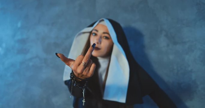 Bad nun showing middle finger