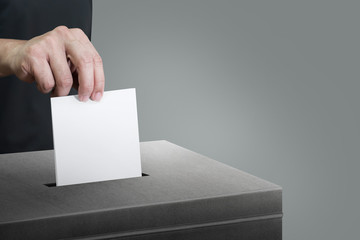 Election vote, hand holding ballot paper for election vote concept at place election background.