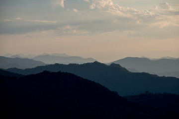 Beautiful landscape layer of mountains in sunset time, North of THAILAND