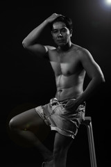 Fototapeta na wymiar Portrait of an athletic Asian Man, black and white photo