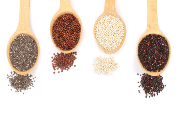 Black red white quinoa and chia seeds in wooden spoon isolated on white background with copy space for your text