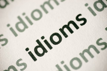 word idioms printed on paper macro