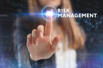 The concept of business, technology, the Internet and the network. A young entrepreneur working on a virtual screen of the future and sees the inscription: Risk management