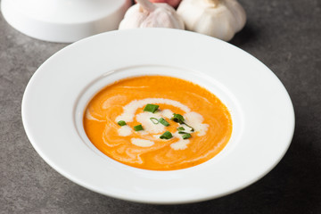 pumpkin soup with spices on table
