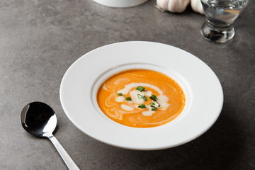 pumpkin soup with spices on table