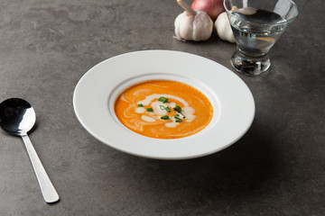 pumpkin soup with spices on table