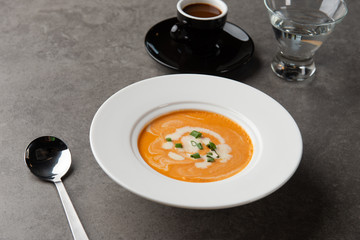 pumpkin soup with spices on table