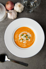pumpkin soup with spices on table flat lay