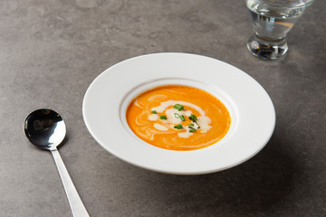 pumpkin soup with spices on table