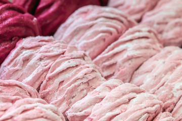 Set of delicate pink zephyr or marshmallow. Homemade natural sweet souffle desert. Pink sweets background