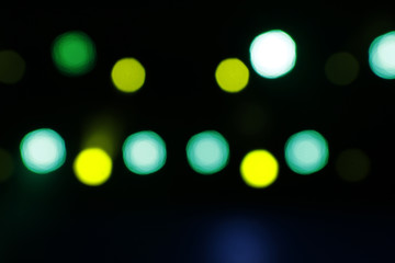 Blurred lights yellow and green with dark scenary blurry bokeh
