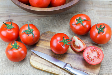 Closeup Fresh ripe tomatoes on wood background