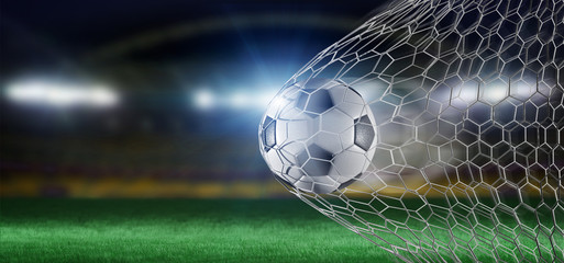 Football ball in the net of a goal - 3d rendering