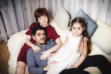 Portrait of happy family in living-room