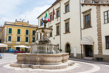 Fototapeta na wymiar Sutri in Lazio, Italy. The Town Hall, fountain and war memorial