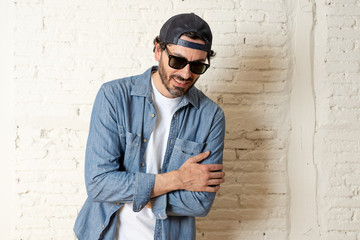 young good looking latin man blogger talking to camera on white background