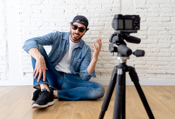 attractive man blogger talking to the camera in internet blog concept.