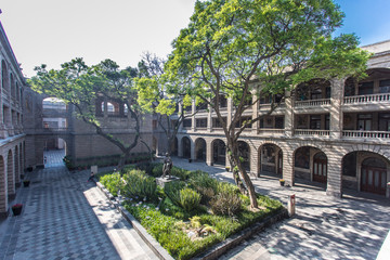 CDMX Mexico City 2018 MAY. Old Custom Ex Antigua Aduana, Antiguo colegio de San Ildefonso, Segreteria Educacion Publica building with internal courts, trees, series of arches paintings by Diego Rivera