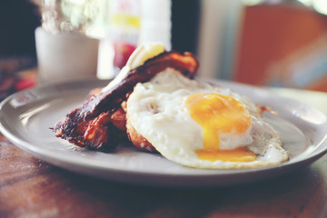 Breakfast french toast with bacon egg and cheese with jam on wood table background