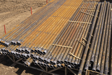 Oil Drill pipe. Rusty drill pipes were drilled in the well section. Downhole drilling rig. Laying...