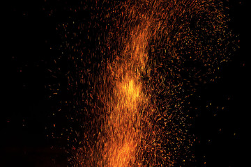 Fototapeta na wymiar bonfire spark in the dark sky in night, shallow focus