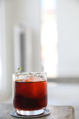 alcoholic old fashioned cocktail with sault garnish