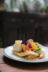Dessert baked Waffle with fruits kiwo grape berry and vanilla ice cream vintage style