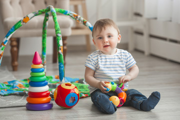 Obraz premium Cute little child playing indoors. Pretty infant baby boy