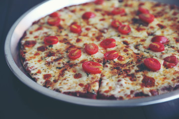 Pizza cherry tomato on wood background