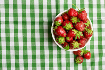 Fresh red strawberry on a dark abstract background. Summer berries. The concept of healthy eating.