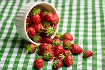 Fresh red strawberry on a dark abstract background. Summer berries. The concept of healthy eating.