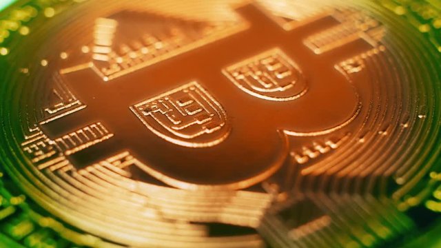 Crypto currency Gold Bitcoin - BTC - Bit Coin. Macro shots crypto currency Bitcoin coins rotating. Seamless looping.