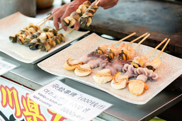 Grill scallop and octopus skewer