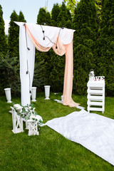 Wedding arch outdoors. Beautiful wedding set up.