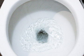 selective focus close up flushing toilet bowl for sanitary, Toilet, Flushing Water, close up, water...