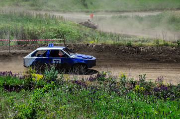 Race of the old wrecked cars. Rally on the open air with dust