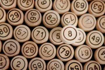 Lucky number 8 on the background of wooden keg lotto. Close up