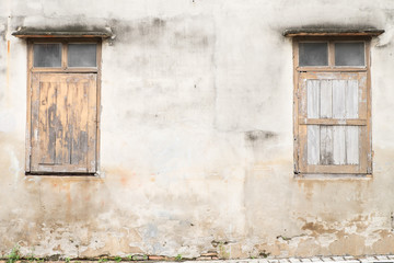 Closed old brown windows of historic house 