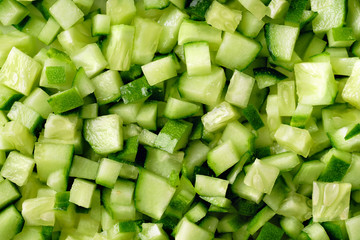 Fresh cucumber finely chopped for cooking salads or wraps
