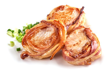 Pork fillet wrapped in bacon, isolated on white background.