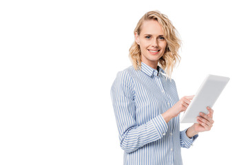 attractive woman using tablet and looking at camera isolated on white
