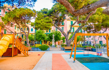 Fototapeta na wymiar Cinque terre Monterosso al mare square near the waterfront, with children's playground in Liguria, Italy