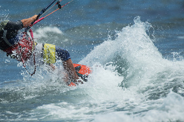 Naklejka premium Kitesurfing Kiteboarding action photos,kite surfer rides the waves