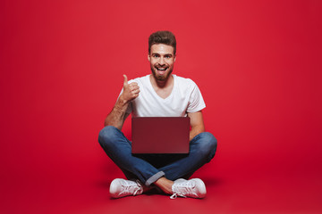 Portrait of a happy young bearded man