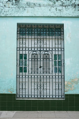 the door of a house in Santa Clara, Cuba, tropical architectural style 