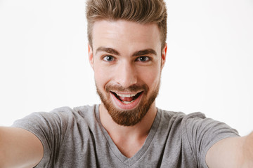 Obraz premium Portrait of an excited young bearded man