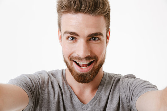 Portrait of an excited young bearded man