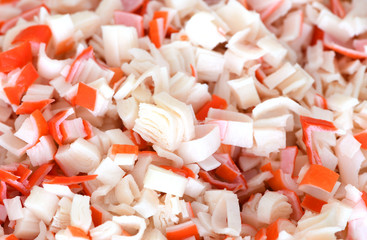 It is the small pieces of crabsticks. It is the texture of a red culinary ingredient.